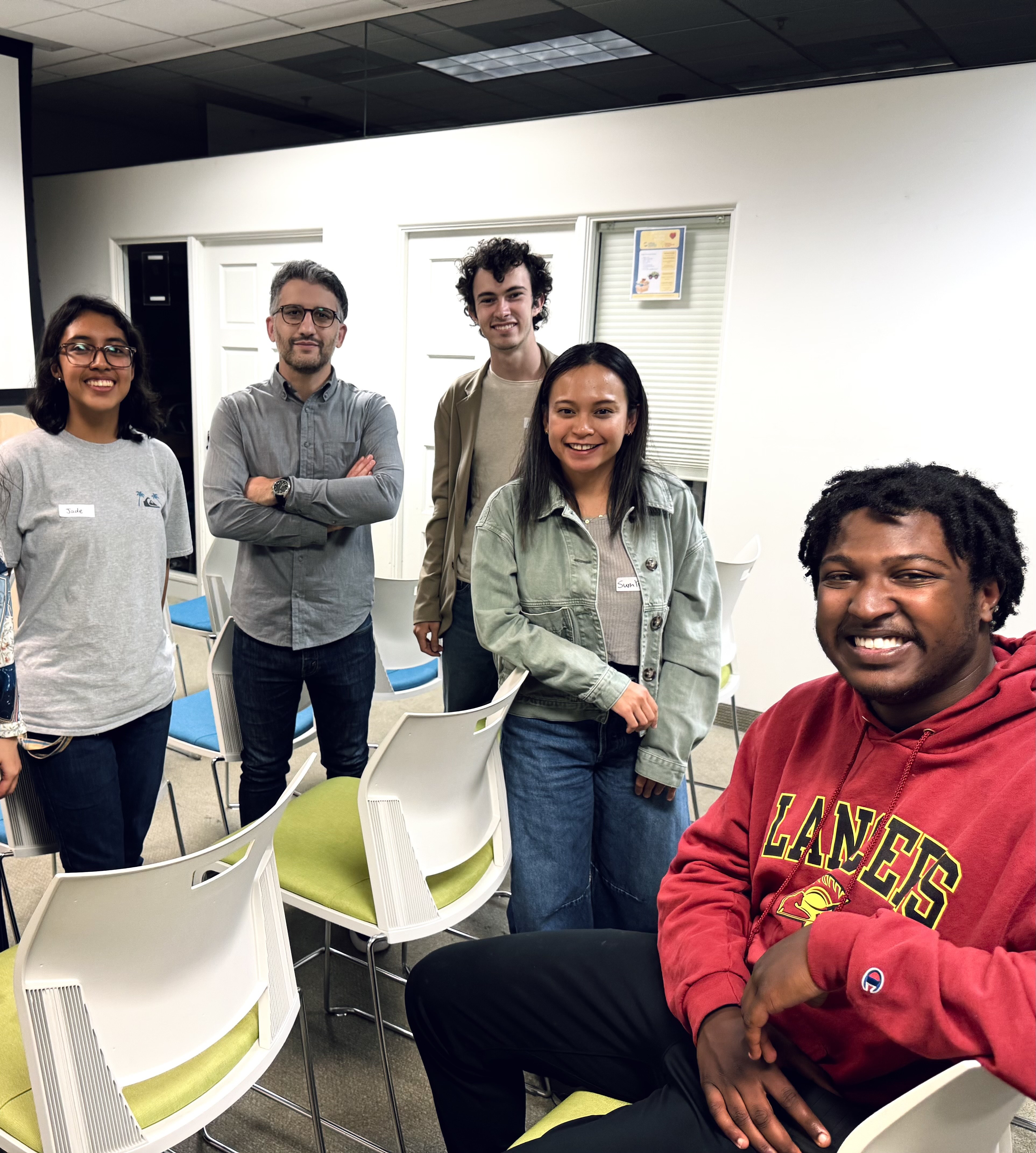 Program director Diego Ratto standing with student composers in a classroom
